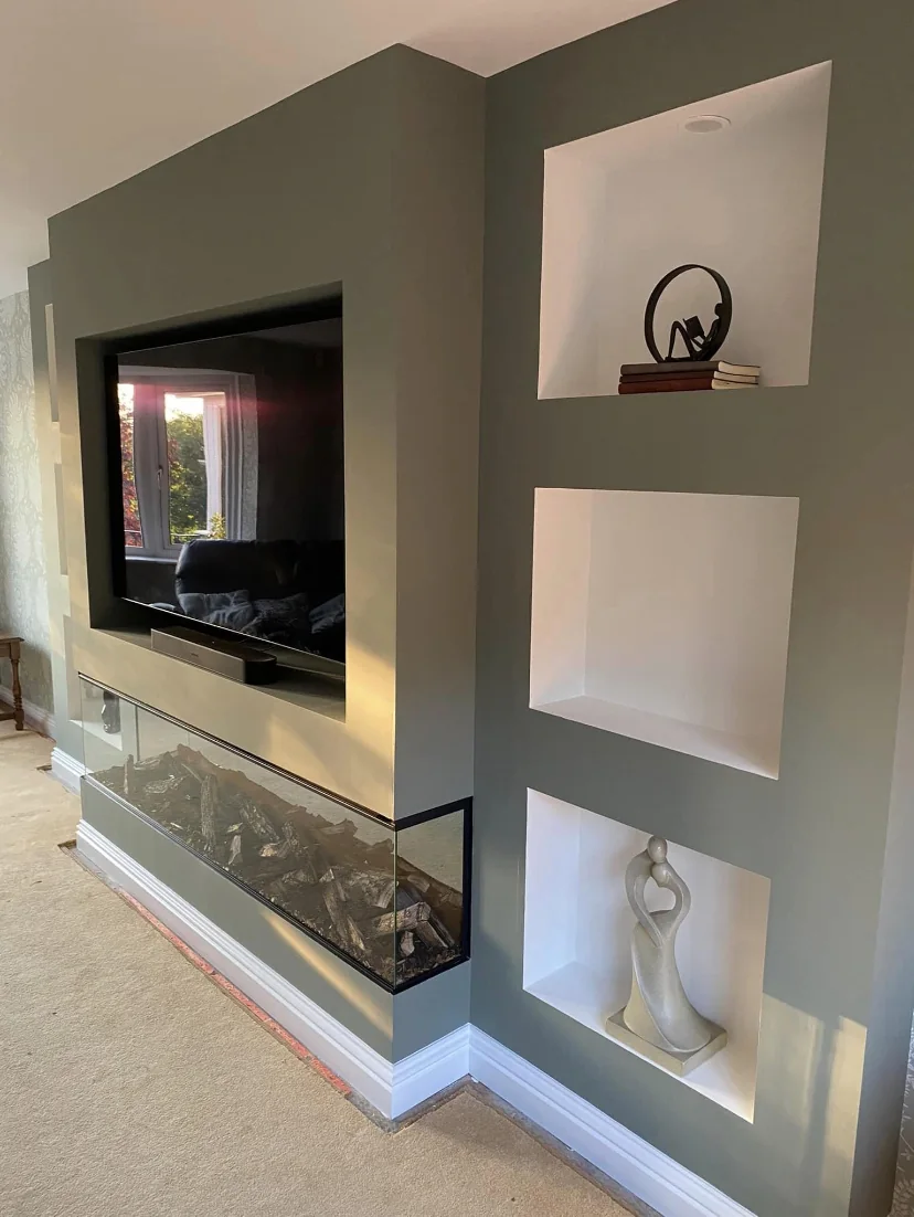 Bespoke media wall with television, fireplace and display niches by Nick's Home Improvements