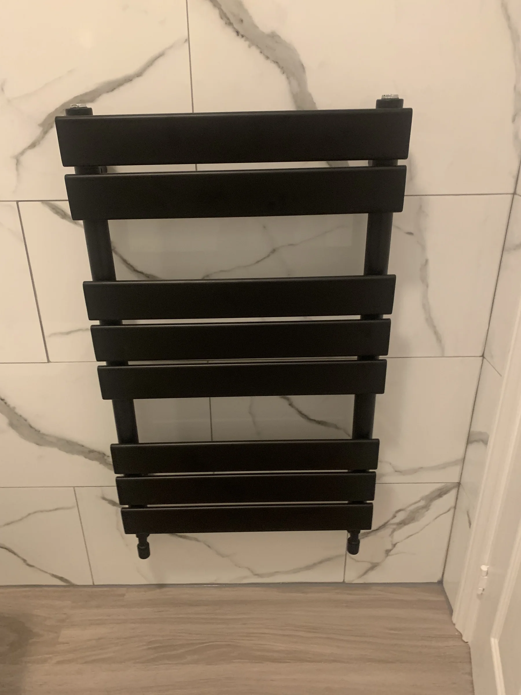 Contemporary black radiator installation by Nick's Home Improvements